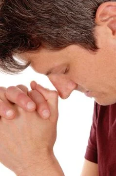 Close up of praying young man. Stock Photos