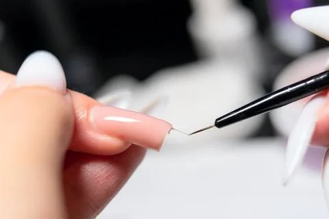 Close-Up of Precise Gel Polish Application with Fine Brush Fotos Stock