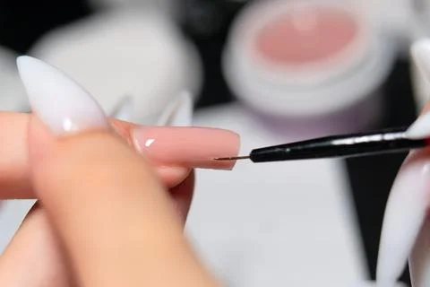 Close-Up of Precise Gel Polish Application with Fine Brush Foto stock
