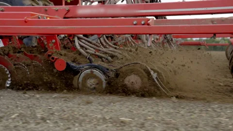 Close-Up Of Precision Air Seeder Disc Openers Cutting Soil While Planting Crops Stock Footage 305168096