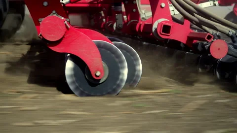 Close-Up Of Precision Air Seeder Disc Openers Cutting Soil And Planting Crops Stock Footage 305382948