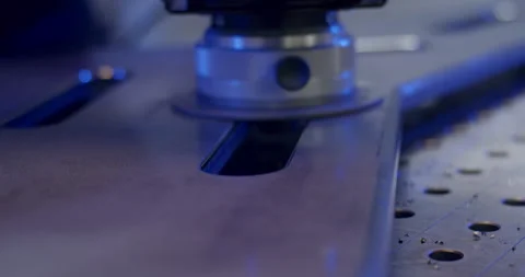 Close-up of a precision-cut slot in a thick industrial metal plate Stockbeeldmateriaal 329474411