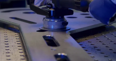 Close-up of a precision-cut slot in a thick industrial metal plate Stockbeeldmateriaal 329474840