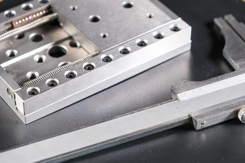 Close up of a precision linear motion guide rail and a caliper Stock Photos
