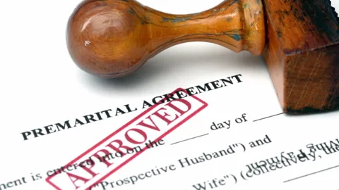 Close up of premarital agreement approved Stock Footage 344477681
