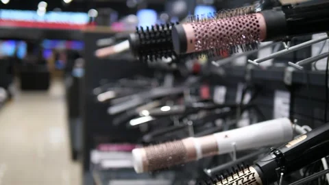 Close-up of premium hair dryer brushes and stylers displayed on a store shelf Stock Footage 314641553