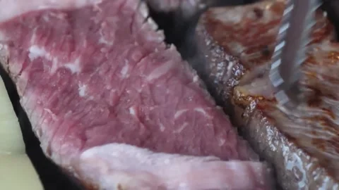 Close-up of Premium Marbled Wagyu Beef Steak Sizzling on a Professional Grill Video stock 338210935