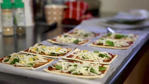 Close Up Preparation of Flatbread Pizza With Sweetcorn Being Placed. Low Stock Footage 240802159