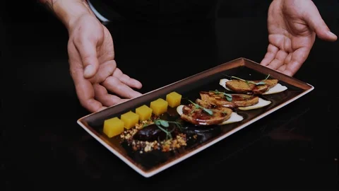 Close up prepared dish on black table meat delicious food fresh meal restaurant Stock Footage 100305134