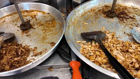 Close-Up of Prepared Shawarma Meat in Collection Trays at Street Food Stall Stock Footage 335998691