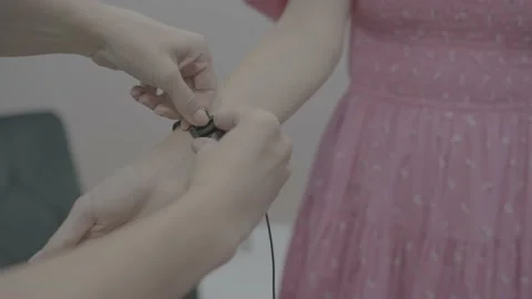 Close up Preparing pacient for Ionic Detox Foot Bath In Beauty Center Stock Footage 218852533