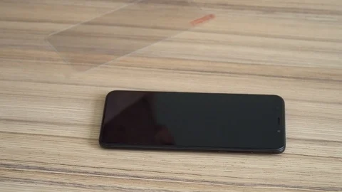 Close-up. Preparing the screen for a new mobile phone. Cleaning with a damp Stock Footage 86822095