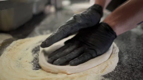 Close-up of preparing soft dough for the future of delicious Italian pizza Vídeo Stock 150417036