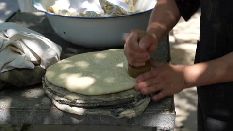 Close up preparing traditional Turkmen flatbread dough for baking, Turkmenistan Stock Footage 346613050