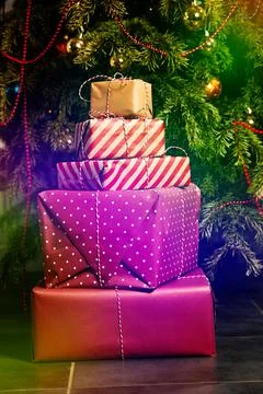 Close-up of a present boxes stack lay under Christmas tree 写真素材
