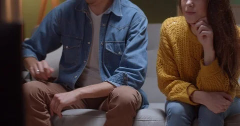 Close up of the present, wrapped box with a red ribbon, boyfriend giving it to Video stock 122502411