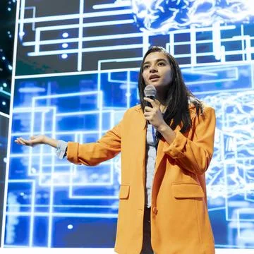 Close up of presenter speaking into microphone next to AI visualization Stock Photos