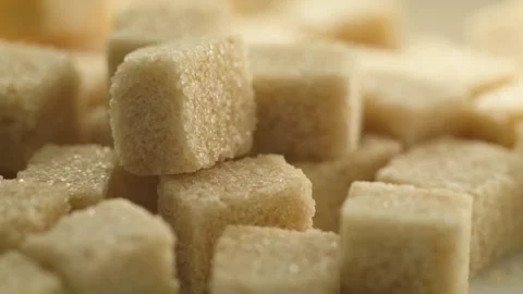 Close up of  pressed brown sugar cubes with smooth panning rotation Stock Footage 285294018