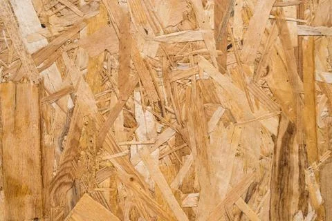 Close up pressed wooden panel background, seamless texture of oriented strand Stock-Fotos