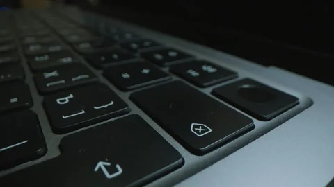 Close up of pressing DELETE button on laptop Stock Footage 300379603