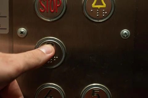 Close-up of pressing the elevator button. Fotos de archivo