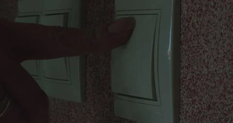 Close-up of pressing the light switch. Stock Footage 305642091