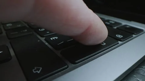 Close up of pressing RETURN button on laptop Stock Footage 300379595