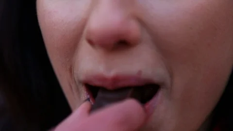 Close up of pretty girl eating a candy Stock Footage 91035053