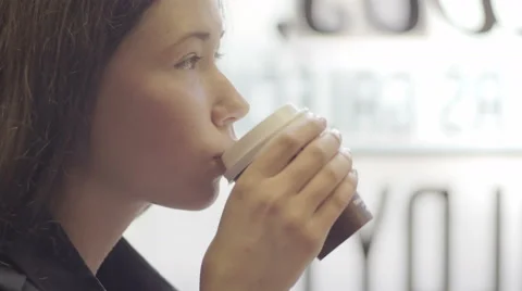 Close-up of pretty girl looking forward while sitting in cafe Stock-Footage 67048084