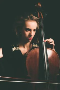 Close up Pretty Girl Playing a Song on Cello Stock Photos