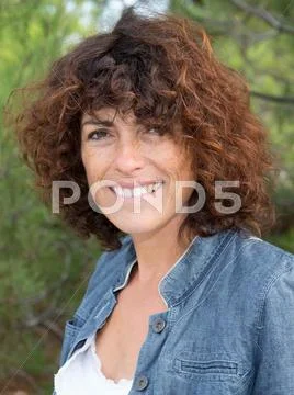 Close-up of a pretty woman smiling at the camera Stock Photos