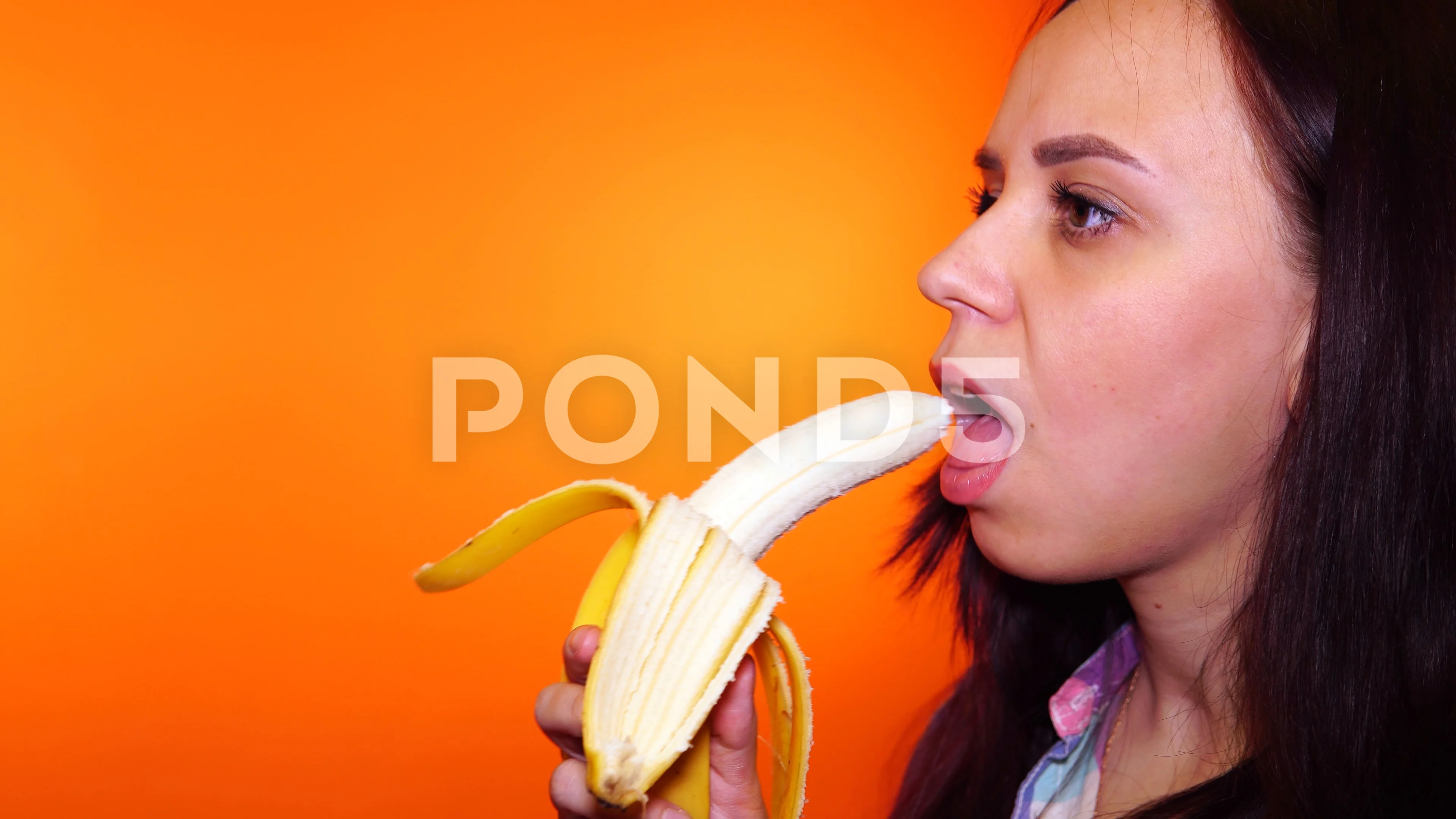 woman eating banana