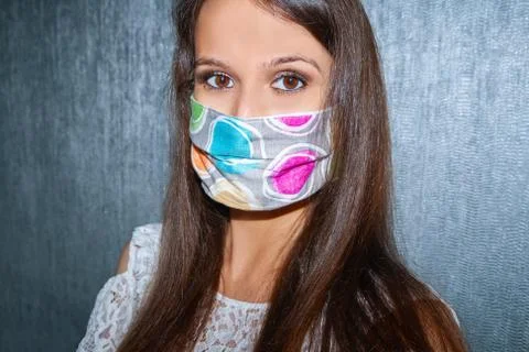 Close up of a Pretty, Young Woman Wearing Home made, Face, Protective Mask. Stock Photos