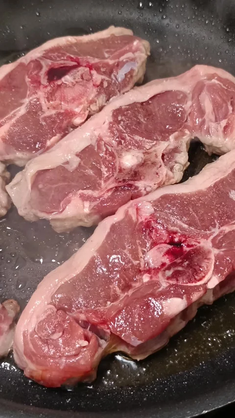 Close-up of prime lamb loin chops cooking. Stock Footage 342224319
