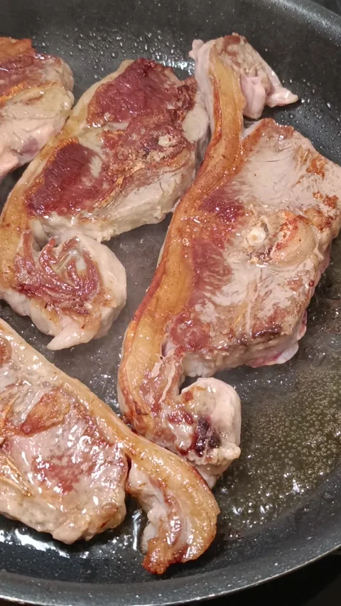 Close-up of prime lamb loin chops cooking. Stock Footage 342224321