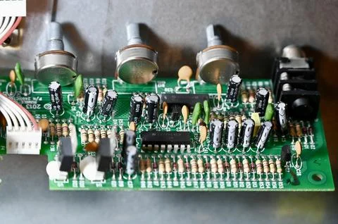 Close-Up of Printed Circuit Board with Capacitors, Resistors, and Potentiom.. Stock Photos
