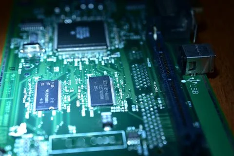 Close-up of a printed circuit board lying on a table. Stock Photos