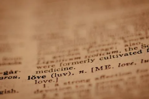 Close up of printed dictionary definition of the word love, with limited focu Stock Photos