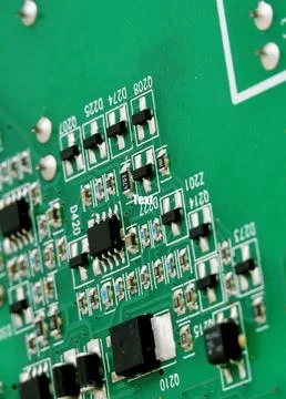 Close up of a printed green computer circuit board with identification number Stock Photos