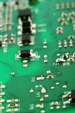 Close up of a printed green computer circuit board with identification number Stock Photos
