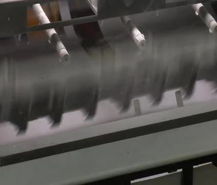 Close-up on printed materials and mechanical feeder on printing press Stock Footage 21596406