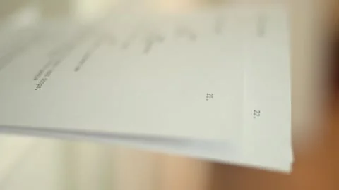 Close up of printed script pages stacking as they come out of a printer. Visual 스톡 동영상 334811255