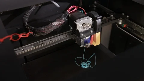 Close up of printer that prints part from a plastic cable thread Stock-Footage 124375083