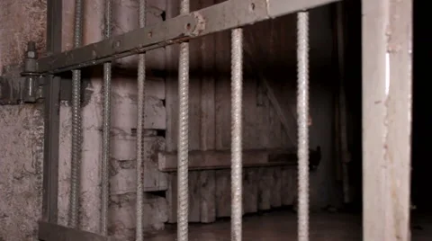 Close up of prison cell door, closing Stock Footage