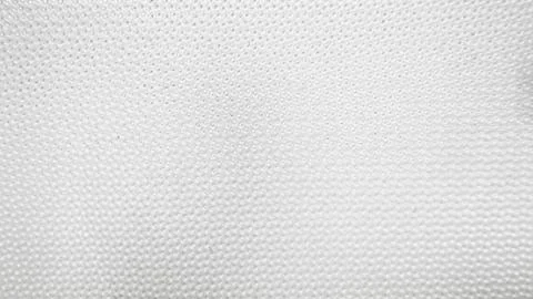 Close-up of pristine white textured surface with uniform small spherical bump Stock Photos