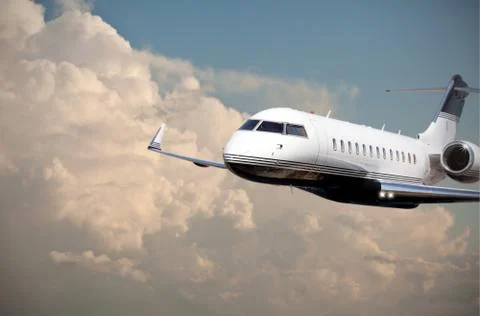 Close up of a private jet flying Stock Photos