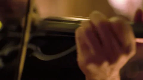 Close up of pro surfer Nuno Santos passionately playing violin during night Video stock 155256765