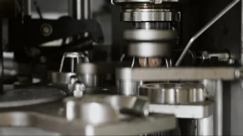 Close-up of the process of attaching the cork to champagne bottles. Stock Footage 288548645