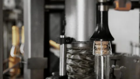 Close-up of the process of attaching the cork to champagne bottles. Stock Footage 288548965