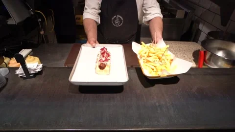 Close-Up - The Process Of Cooking A Burger With French Fries In A Professional Video stock 196162376
